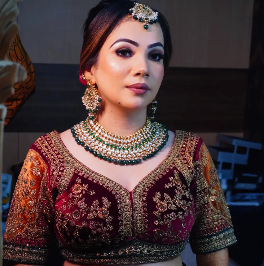 Bridal makeup with maroon velvet blouse and emerald jewellery
